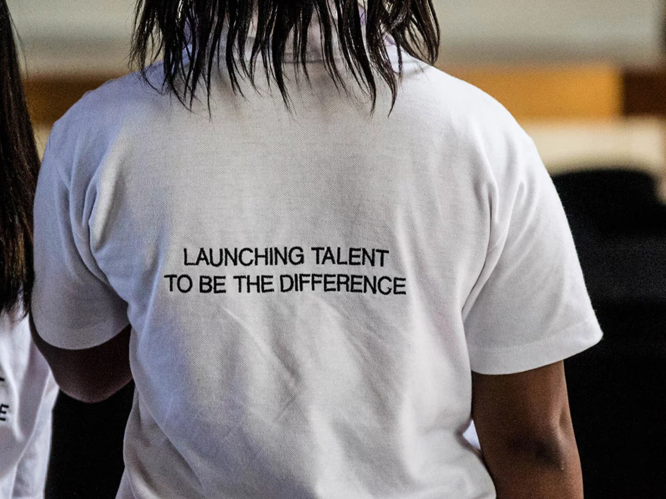 T shirt with message: Launching talent to be the difference