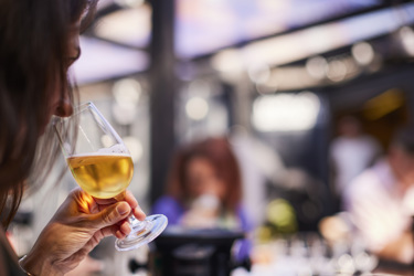 Woman sniffing beer