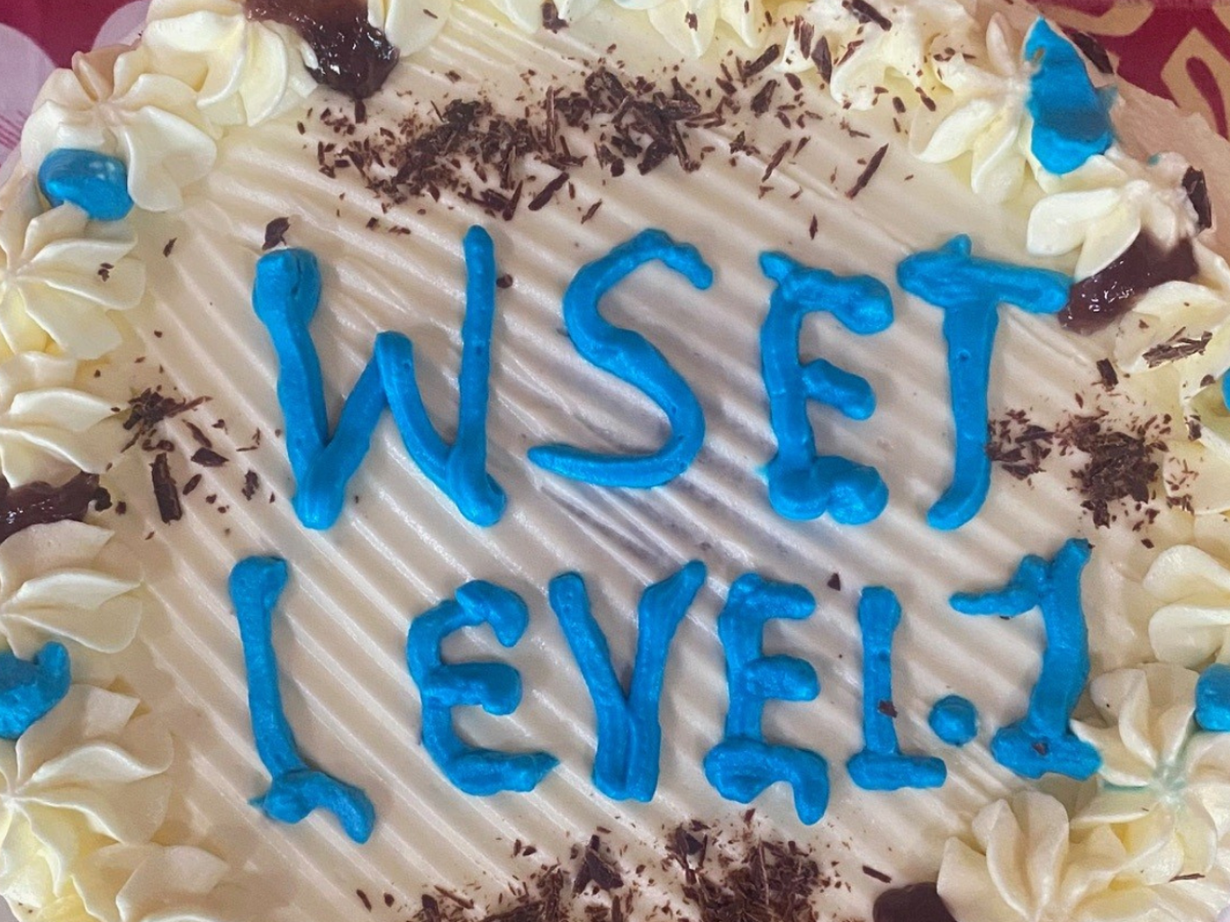 cake with icing spelling out, 'WSET Level 1'