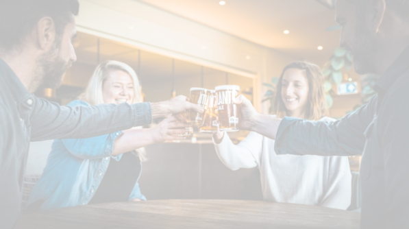 People clinking glasses in a bar