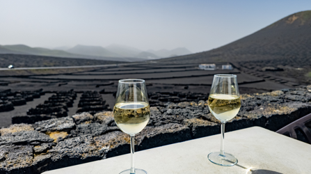 Wine glasses overlooking volcanic land