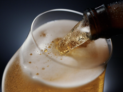 Bottled beer being poured into glass