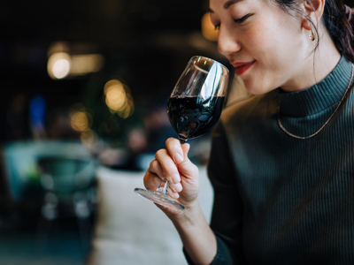 Woman sniffing glass
