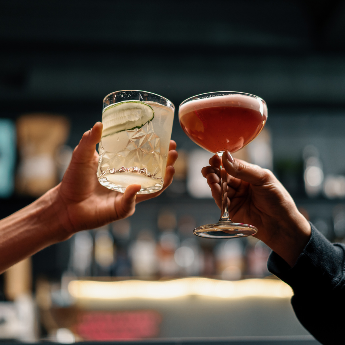 Clinking cocktail glasses