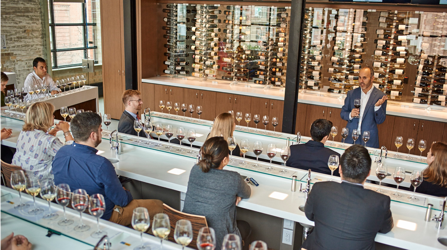 Educator Giving Wine Tasting Course To Students