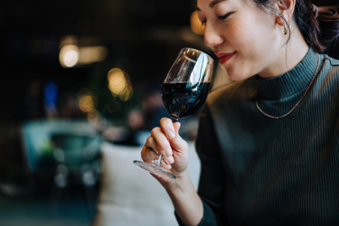 Woman sniffing wine