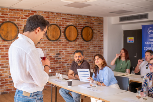 Man teaching at front of classroom of students